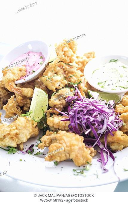 gourmet calamari tempura squid with tzatziki and pickled beetroot sauce meal