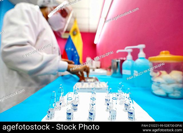20 February 2021, Venezuela, Caracas: A health worker prepares a dose of Russia's new Sputnik V Covid-19 vaccine at a public hospital
