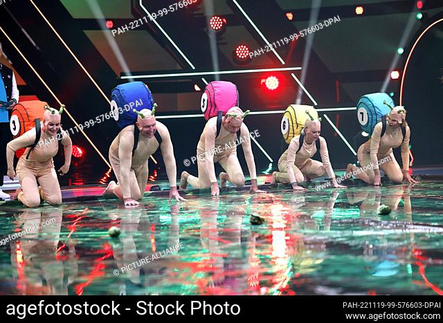18 November 2022, North Rhine-Westphalia, Cologne: In the opening show of the Sat.1 TV show Promi Big Brother 2022, the candidates have to crawl over a slimy...