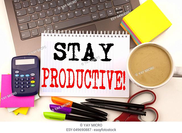 Word writing Stay Productive in the office with surroundings such as laptop marker pen stationery coffee Business concept for Concentration Efficiency...