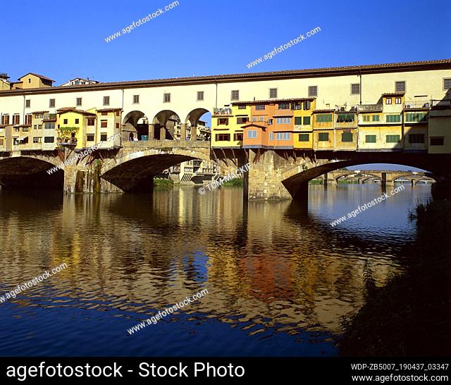 Ponte Vecchio reflecting in the River Arno, Florence, Tuscany, Italy