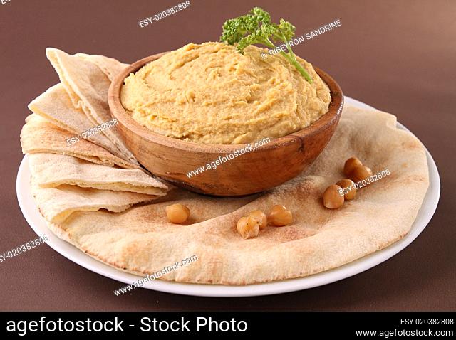 plate with hummus and pita bread