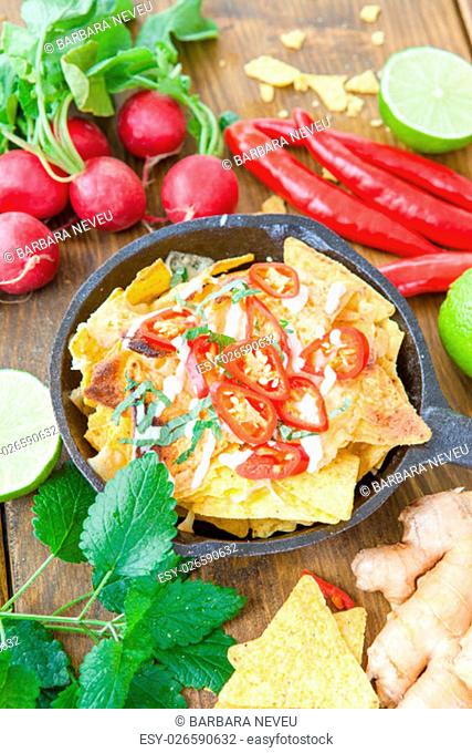 about baked nachos with cheese and spicy red chili