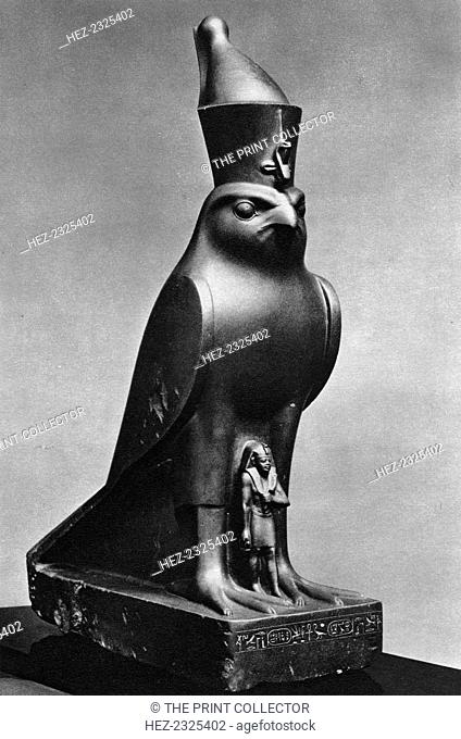 A Horus falcon with King Nectanebo I (380 BC-362 BC), c370 BC (1936). Basalt statuette. Found in the collection of the Metropolitan Museum, New York