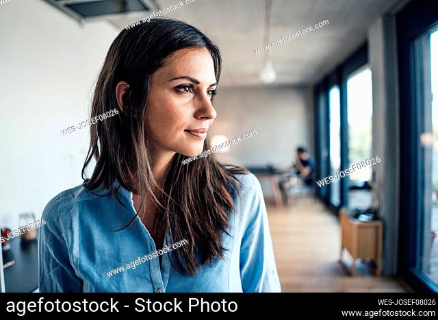 Beautiful woman with brown hair at home