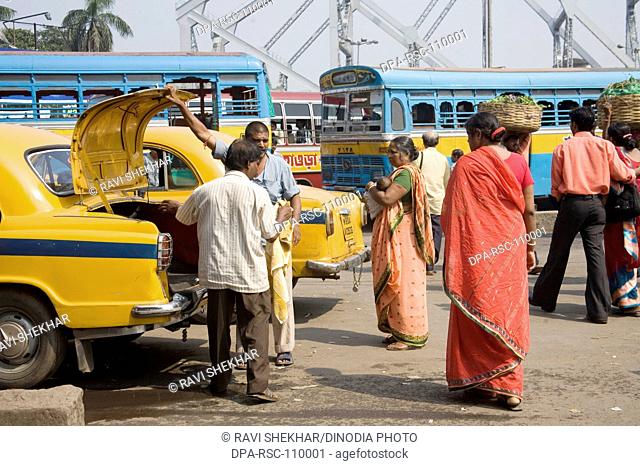 Street Scene ; Human activities ; people near around Howrah Bridge now Rabindra Setu ; Calcutta now Kolkata ; West Bengal ; India
