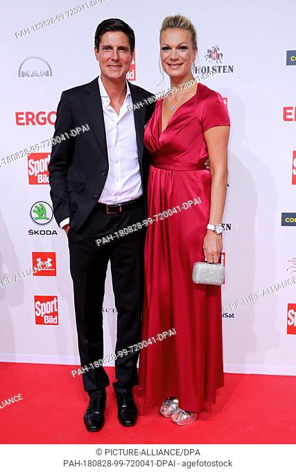 27 August 2018, Hamburg, Germany: Maria Höfl-Riesch, former German ski racer, and her husband Marcus Hoefl attend the presentation of the ""Sport Bild Award...