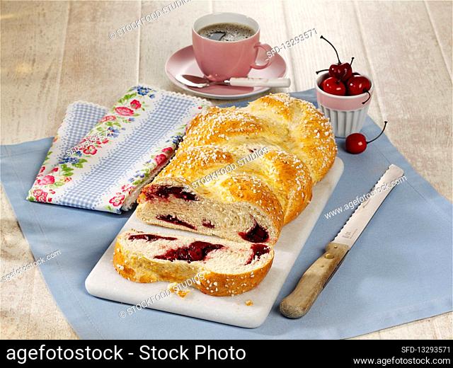 A yeast dough plait with a cherry filling