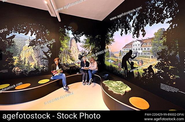 28 April 2022, Thuringia, Bad Liebenstein: Guests sit in the new visitor center at Altenstein Castle and Park. In the newly designed visitor center in the...