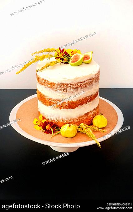Vanilla Layer Cake Decorated with Edible Fresh Flowers and Fruit