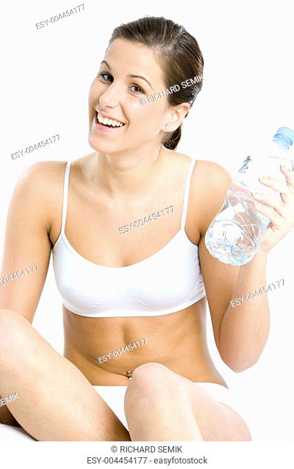 portrait of sitting woman with bottle of water
