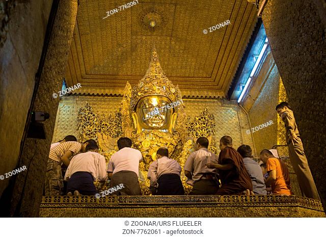 The Mahamuni Buddha at the Mahamuni temple in the City of Mandalay in Myanmar in Southeastasia