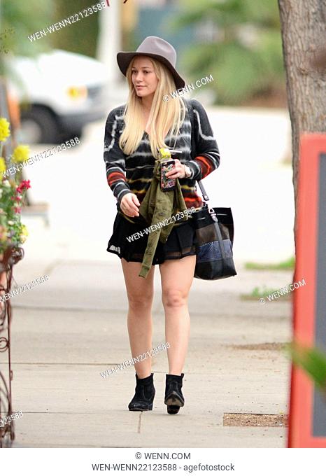 Makeup free Hilary Duff wearing a felt hat and a short black skirt, takes son Luca Comrie to Pint Size Kids Featuring: Hilary Duff Where: Los Angeles