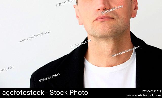 Cropped photo of depressed mature man. White background. High quality photo
