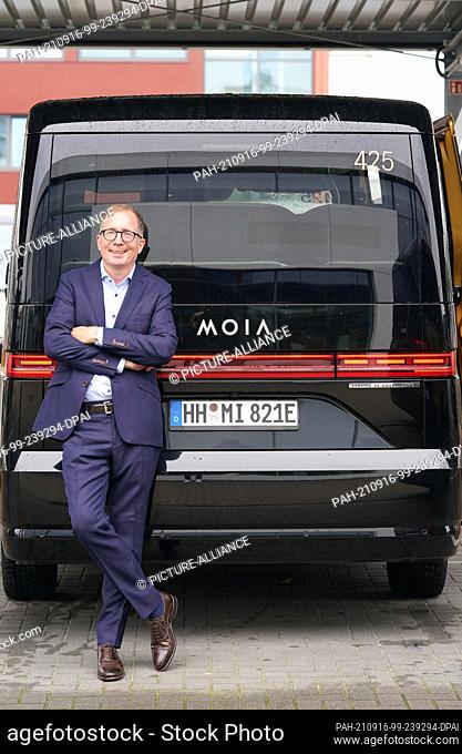 15 September 2021, Hamburg: Robert Henrich, CEO of Moia, stands by a shared taxi at the Moia Hub in Hamburg. Photo: Marcus Brandt/dpa