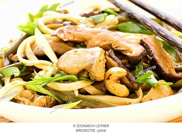 Thai chicken curry with mushrooms and noodles