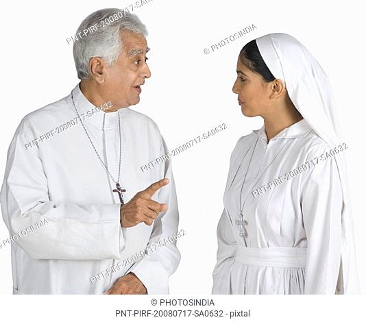 Priest talking to a nun