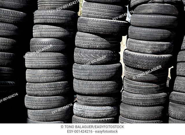 car tires used pneus stacked in rows for recycle