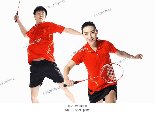 Athletes playing badminton