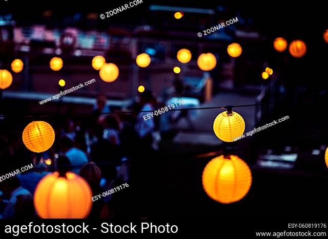 yellow light balls lighting the streets at night