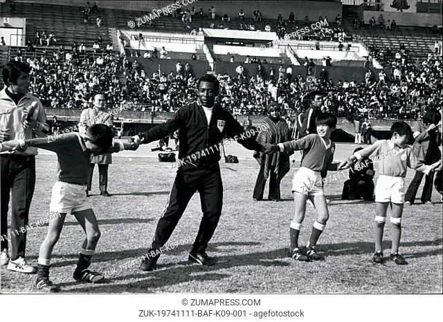 Nov. 11, 1974 - 'King' Pele Shows Japanese Schoolboys How To Score: Retired Brazilian football star Pele, coached Japanese schoolboys some of the finer points...