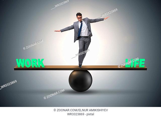 Businessman balancing between work and life in business concept