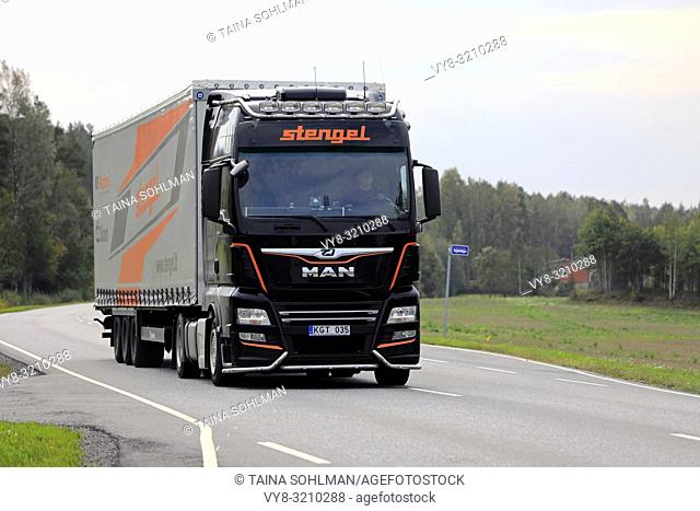 Salo, Finland - September 21, 2018: Customised MAN semi trailer truck of Stengel LT hauls goods on rural highway in South of Finland on day of autumn