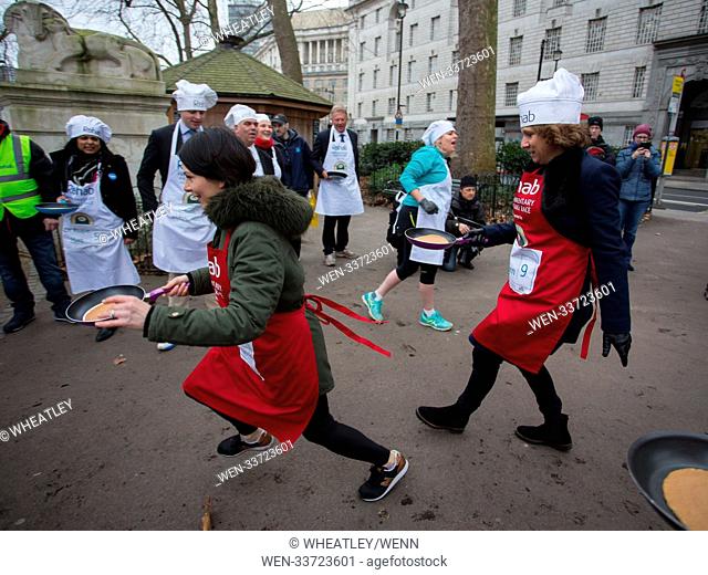 The 21st annual Rehab Parliamentary Pancake Race, supported by Lyle’s Golden Syrup, between a team of MPs and media in Victoria Tower Gardens, Millbank