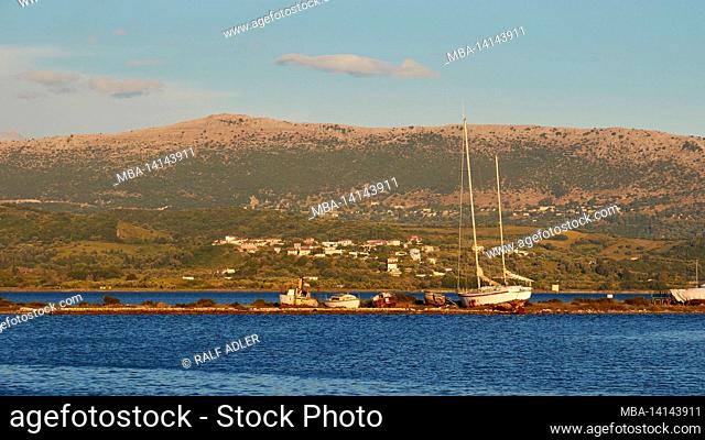 greece, greek islands, ionian islands, lefakada or lefkas, lefkada city, capital, dusk, swing bridge, lighthouse, view over the embankment towards the mainland