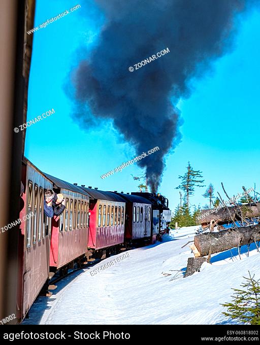 Harz national park Germany, Steam train on the way to Brocken through the winter landscape, Famous steam train through the winter mountain