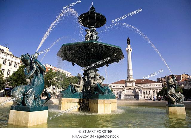Water from the Rossio fountain appears to be arching over the statue of Dom Pedro IV at the square named after him in Lisbon, Portugal, Europe
