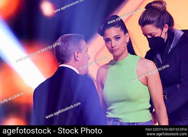 18 March 2022, North Rhine-Westphalia, Cologne: Amira Pocher (M), host, and Joachim Llambi, jury member, talk during a commercial break in the RTL dance show...