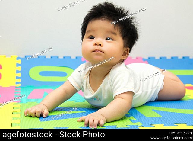 Little baby crawling on floor