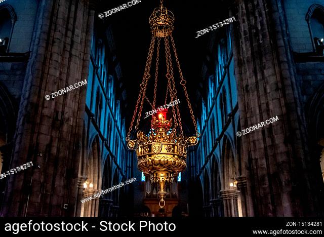 KILKENNY, IRELAND, DECEMBER 23, 2018: Interior of St. Mary's Cathedral, with a hanging lamp inside a magnificent detailed gold metal crafted structure