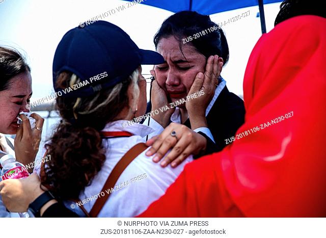 November 6, 2018 - Jakarta, Indonesia - Families and colleagues of passengers and crew of Lion Air flight JT610 pray and cry on the deck of Indonesia Navy ship...