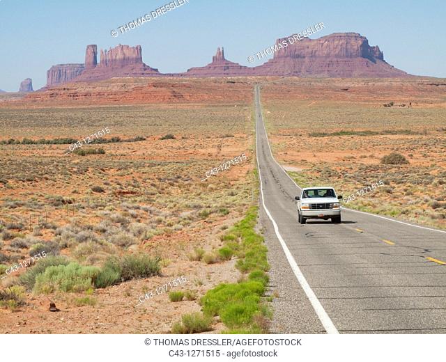 USA - One of the most famous views of the Monument Valley is the long straight road US 163 leading across flat desert towards sandstone buttes and pinnacles of...