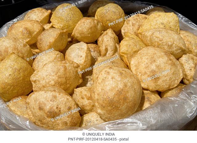 Close-up of traditional Indian snack 'pani puri' at a food stall, Sohna, Gurgaon, Haryana, India