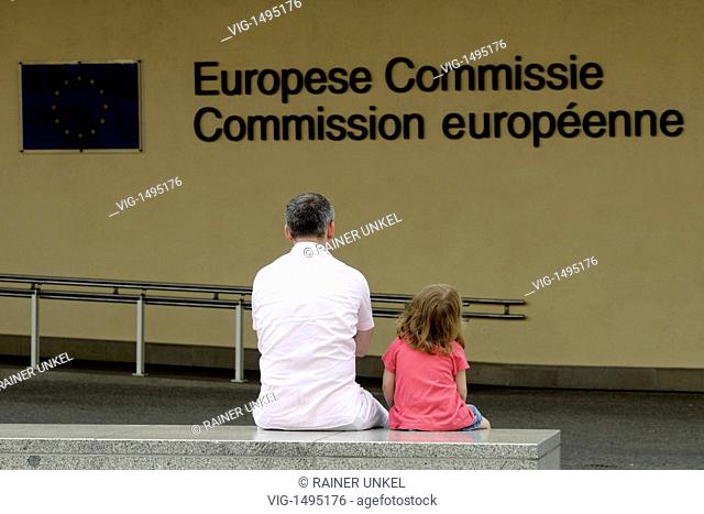 BELGIUM, BRUSSELS, 02.07.2009, BEL, BELGIUM : A man and his daughter in front of the Berlaymont building of the EU-Commission in Brussels - Brussels, Brussels