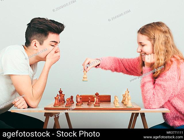 Checkmate. Boy is surprised by last move his opponent in chess game. Copy space for text at the top of image