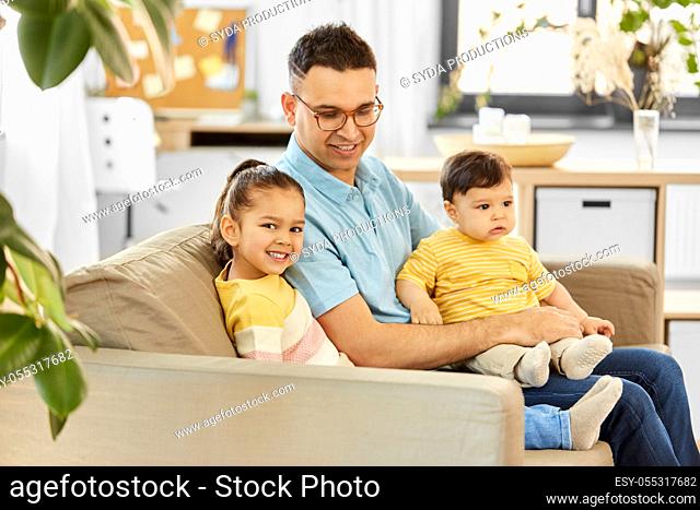 happy father with little children at home