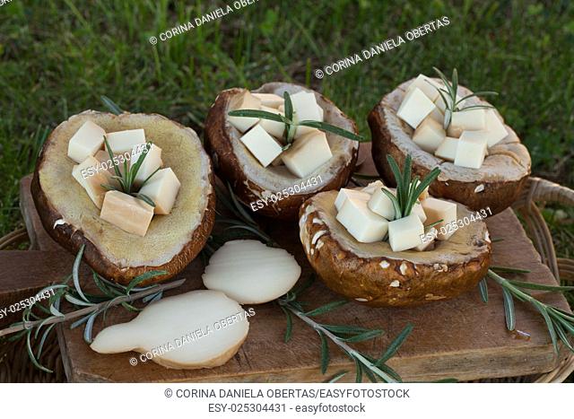Porcini mushrooms filled with scamorza cheese and rosemary, ready to be grilled