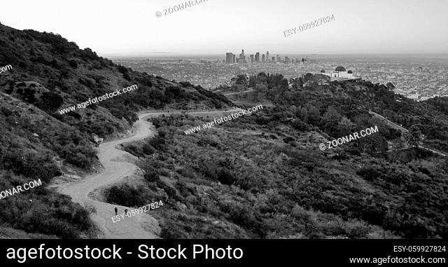 Hikers leave the lot at Griffith Observatory walking to Dante's View in Los Angeles