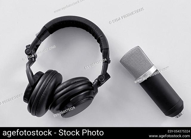 headphones and microphone on white background