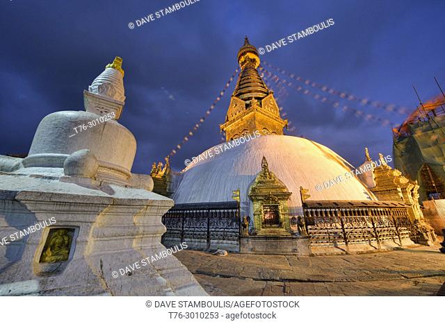 Swayambhunath, the Monkey Temple, lit up at dusk, Kathmandu, Nepal