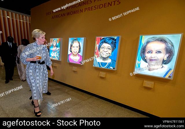 Princess Astrid of Belgium passes by African Women President posters at Musée des Civilisation Noires during the Belgian official reception during the second...