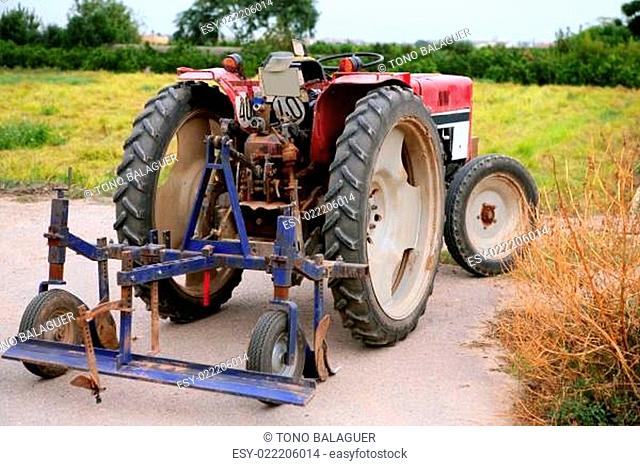 Agriculture aged red tractor retro vintage machine