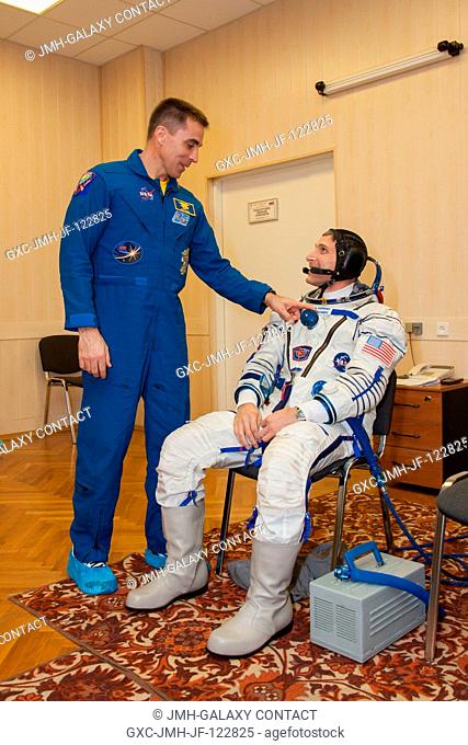 NASA's prime and backup crew members for Expedition 3536 share a quiet moment March 17 during a systems dress rehearsal called a fit check at the Baikonur...