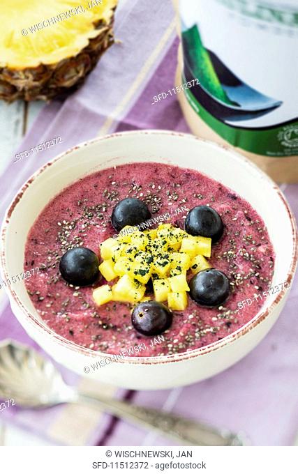A smoothie bowl with grapes and pineapple