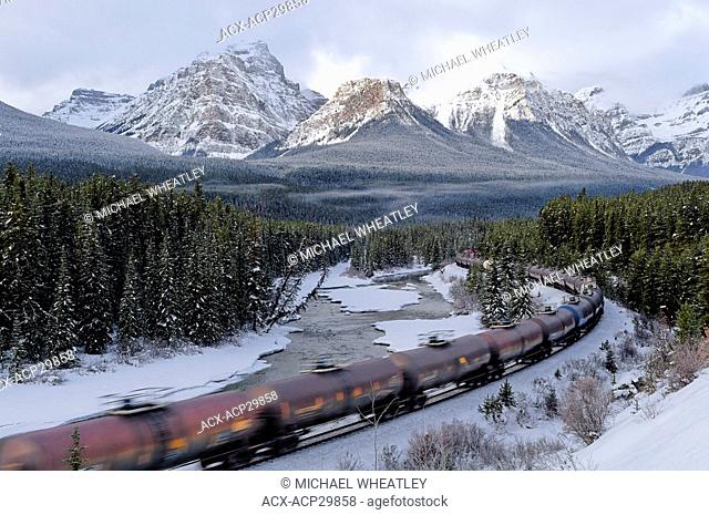 Train at Morant's curve with Haddo Peak, Saddle Mountain and Fairview Mountain in the background, Banff National Park, Alberta, Canada