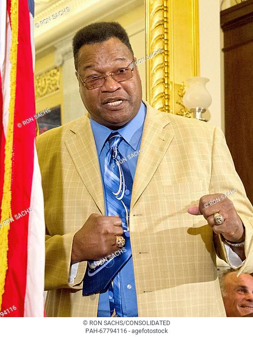 Former World Heavyweight Champion Larry Holmes shows his style as he makes remarks at a press conference to discuss the observational study on the brain health...